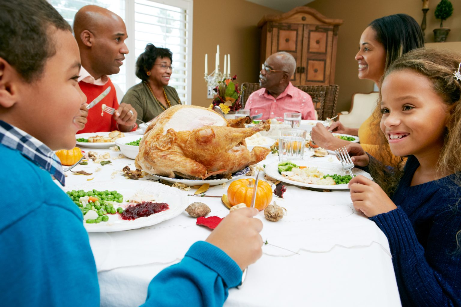 family enjoying Thanksgiving meal